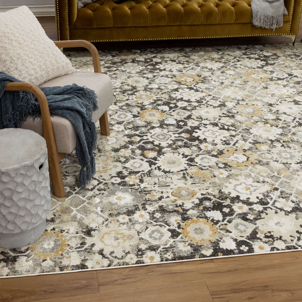 Gray floral patterned area rug with beige and yellow accents in a cozy living room setting for home improvement projects
