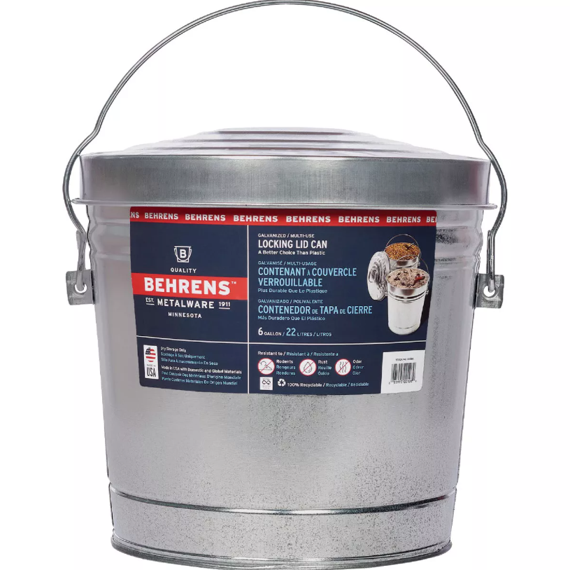 Galvanized metal garbage can with locking lid, wire handle, and product label, suitable for waste baskets and cleaning tasks