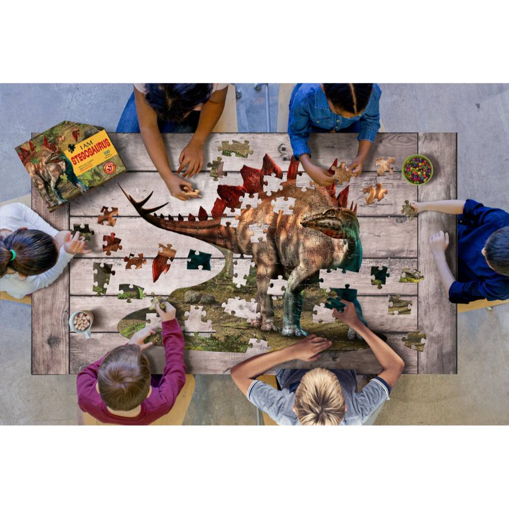Children assembling a colorful Stegosaurus dinosaur puzzle from the Toys & Games and Puzzles collections under $50