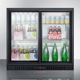 36 inch beverage cooler with tinted glass sliding doors displaying assorted bottled and canned drinks in kitchen appliance setting