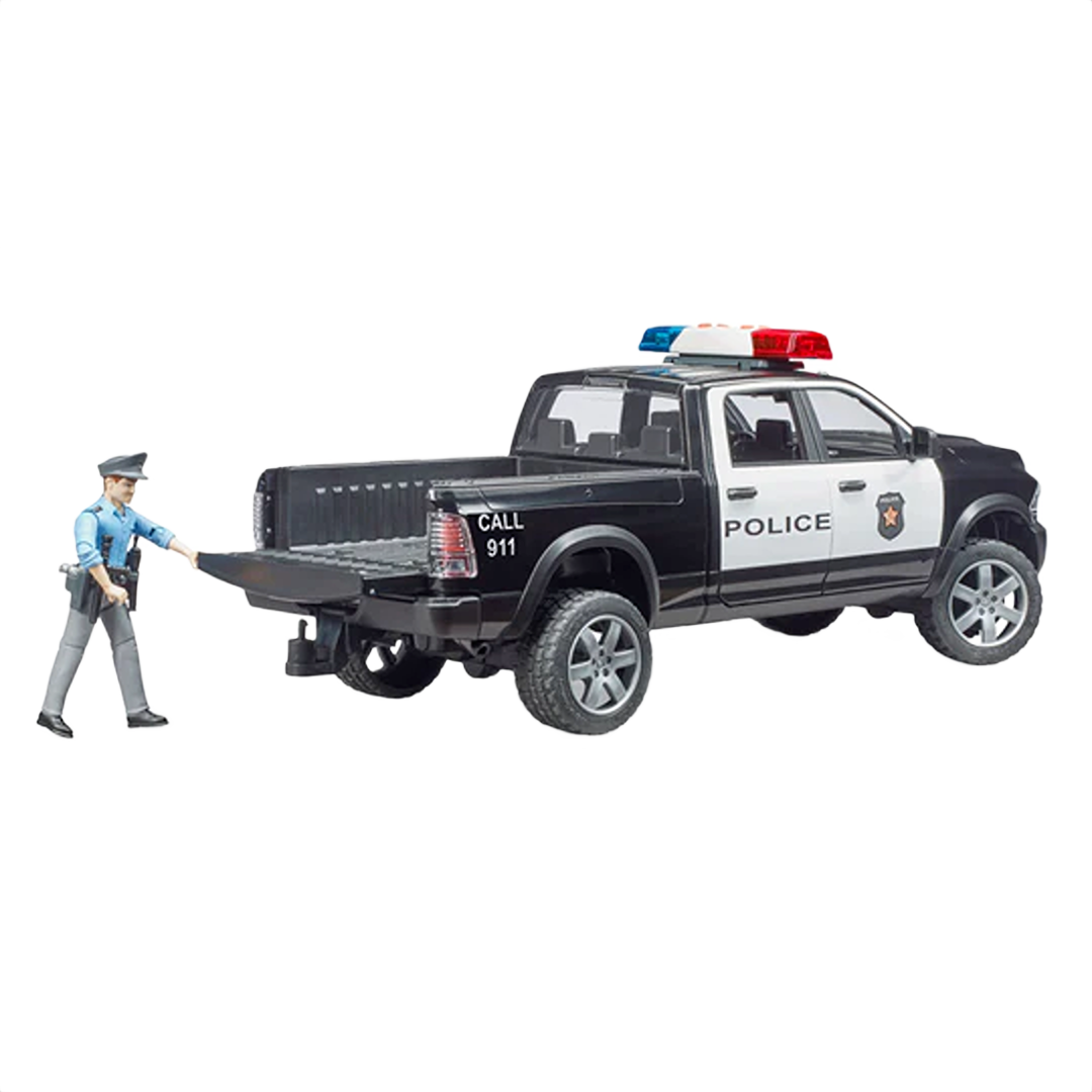 Black and white police pickup toy with light bar and figure of policeman pulling open tailgate for role play