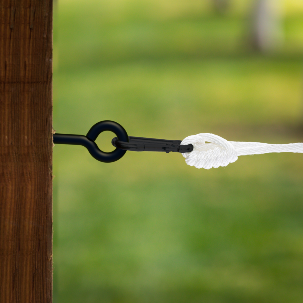 Black lag screw eye fastened to wood post securing white rope with a hook, ideal for home improvement projects under $50