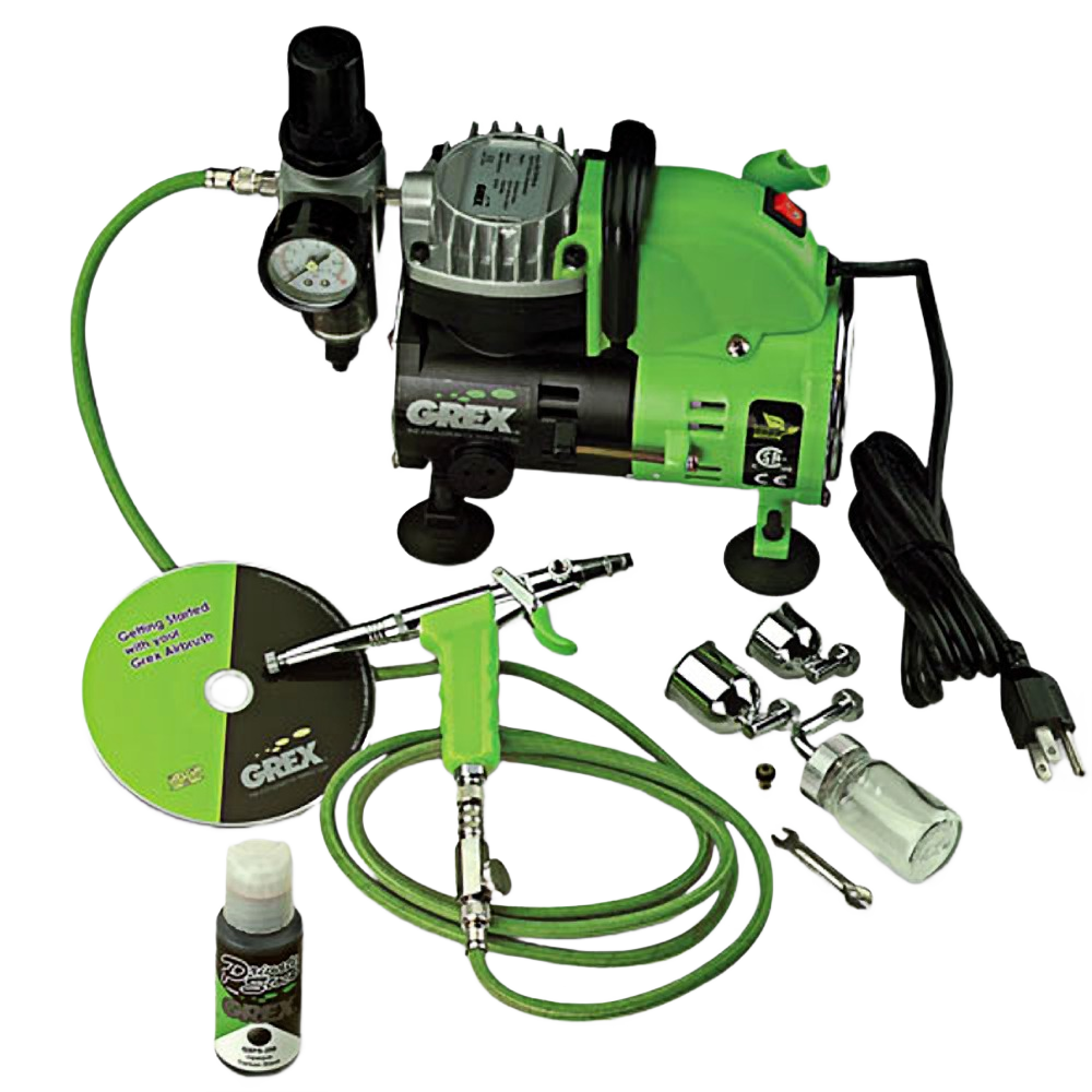 Green and black airbrush and compressor kit with hose, accessories, and instructional DVD for home improvement projects