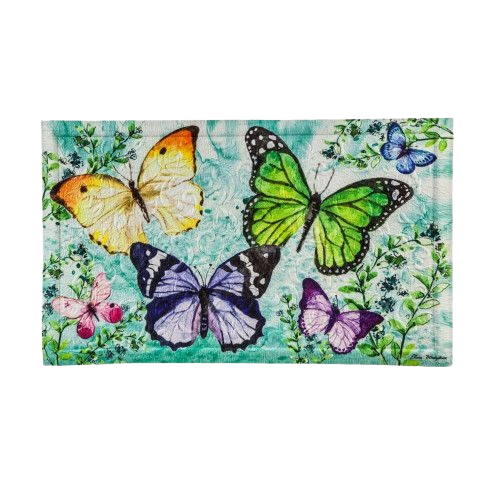 Multicolored butterflies on a textured green and white mat with floral and leafy accents for home decor.