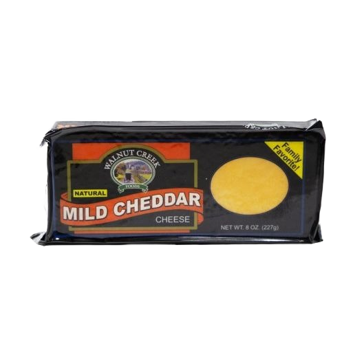 Block of mild cheddar cheese in black packaging labeled natural and family favorite from food and beverage collection