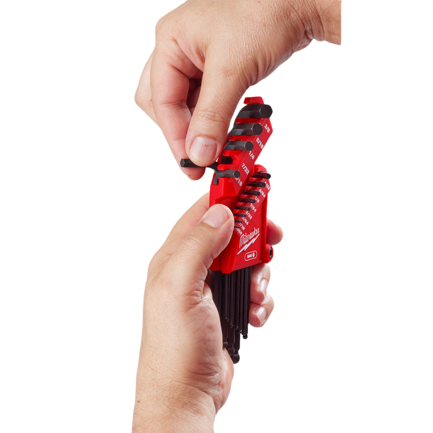 Hands holding a red Milwaukee 13-key ball end L-key set with black hex keys for home improvement tools use