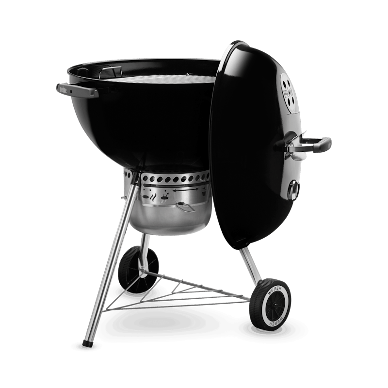 Black charcoal kettle grill with vented lid, wheels, and tripod legs for outdoor grilling and lawn use