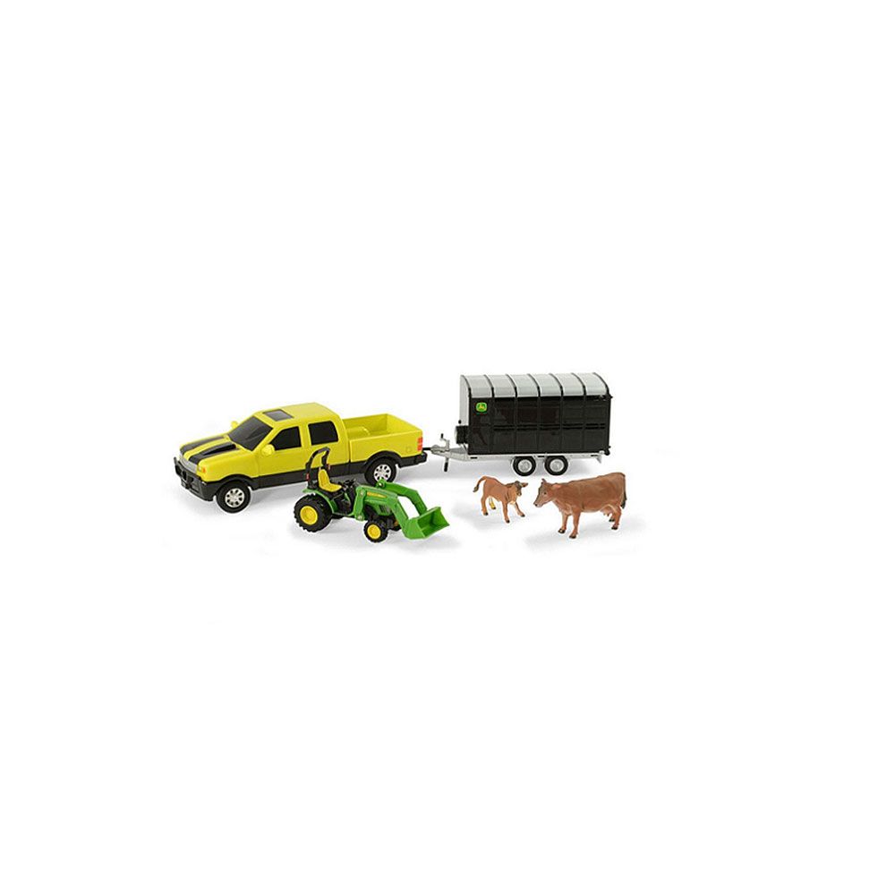 Yellow toy truck with green tractor, black livestock trailer, and two brown cow figures for playset collection