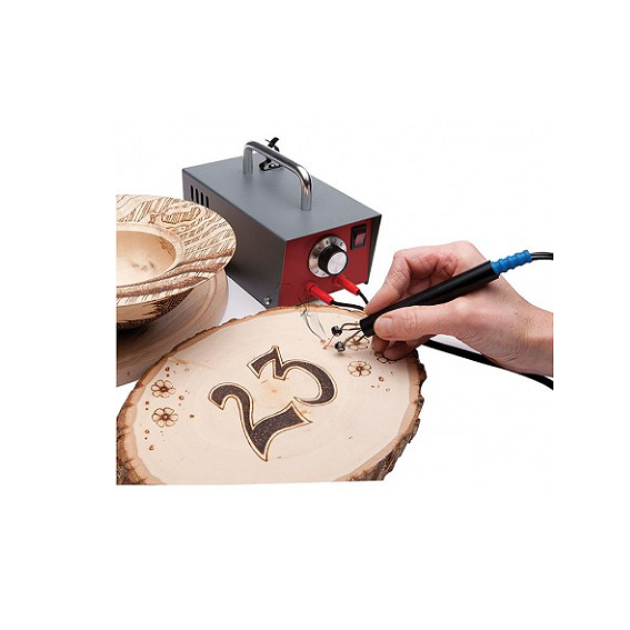 Hand using Sorby Artist's Pyrography Machine to burn decorative number and floral design on a wood slice for crafts