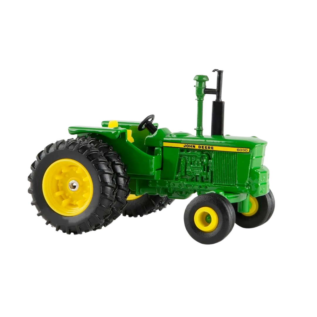 Green and yellow scale model tractor with detailed engine and large rear tires for collectible display
