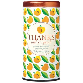 Decorative tea tin with peach pattern labeled thanks you're a peach containing 50 premium black tea bags
