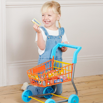 Child playing with colorful Casdon Shopping Trolley and toy groceries from pretend play toys and Toys & Games collections