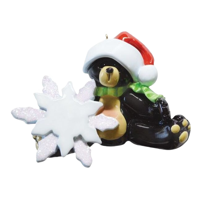 Sitting black bear ornament wearing Santa hat and green scarf holding glittery snowflake for Christmas decor under $50 collection