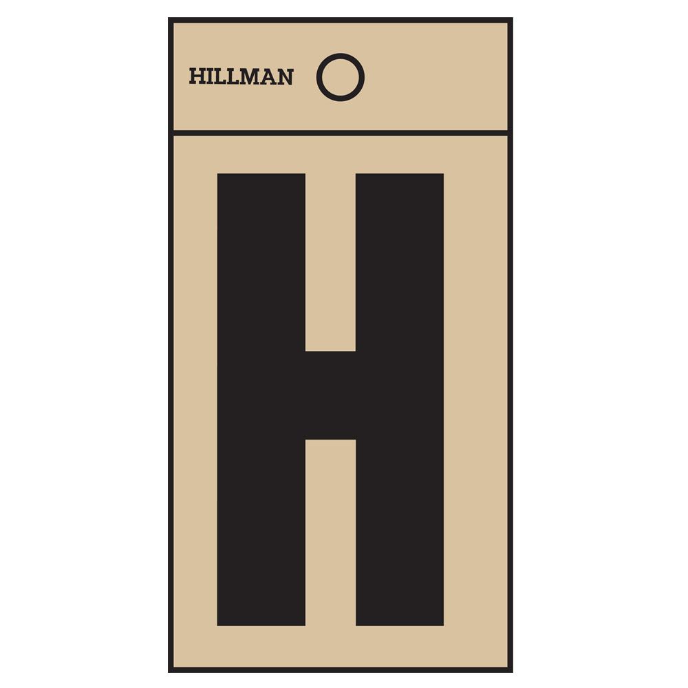 Black letter H on square-cut gold-colored Mylar sheet for home improvement or tool labeling purposes