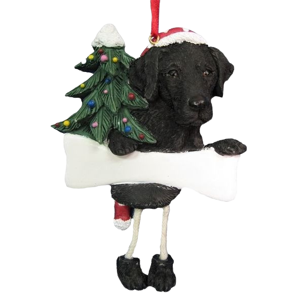 Black Labrador Christmas ornament with dangling legs holding blank sign and decorated tree for Christmas décor under $50