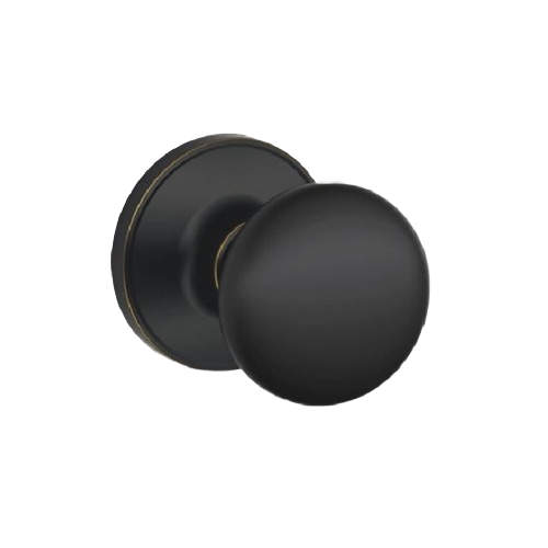 Aged bronze passage door knob with smooth rounded design for home improvement and interior use