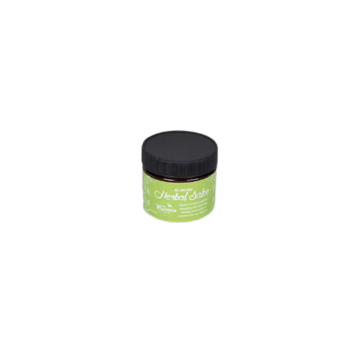 Small herbal healing salve in green container with black lid for soothing skin care and natural remedies