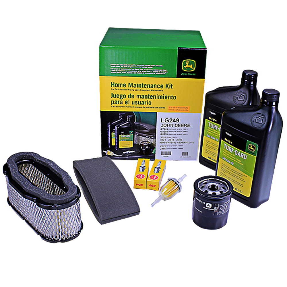 Green and yellow maintenance kit box with oil bottles, air and fuel filters, spark plugs, and small fuel filter parts arranged nearby