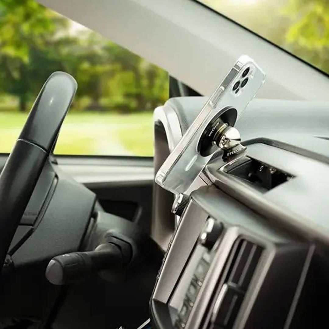 Magnetic phone mount attached to vehicle dash holding clear MagSafe iPhone case in electrical and home improvement tools collection