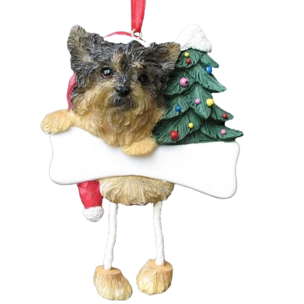 Playful Yorkie ornament with dangling legs holding blank sign beside decorated Christmas tree for holiday décor under $50