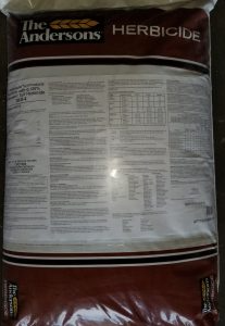 Bag of pre-emergent herbicide for effective crabgrass and weed control in lawn care and fertilizer collections