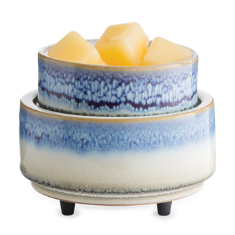 Blue and white ceramic electric wax warmer with classic design holding four yellow wax melts for home fragrance
