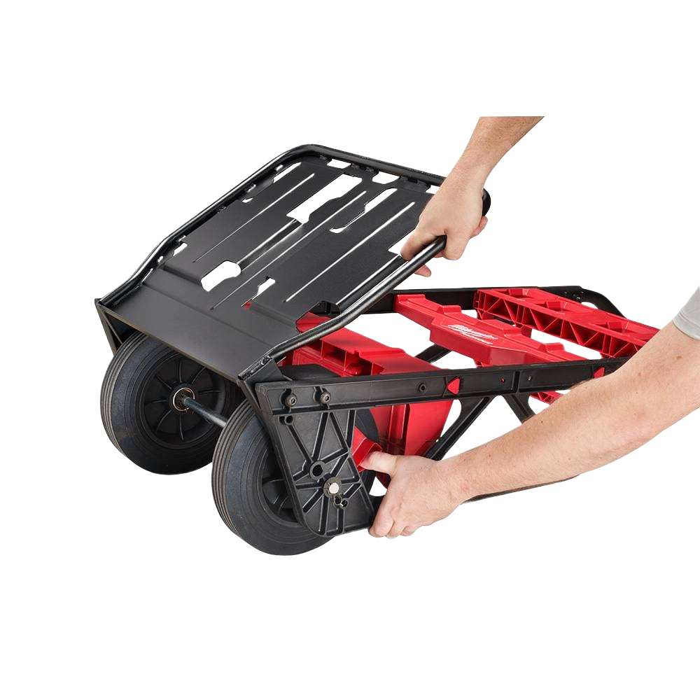 Hands folding a red and black two-wheel cart with flat-free wheels for tool storage and workshop use