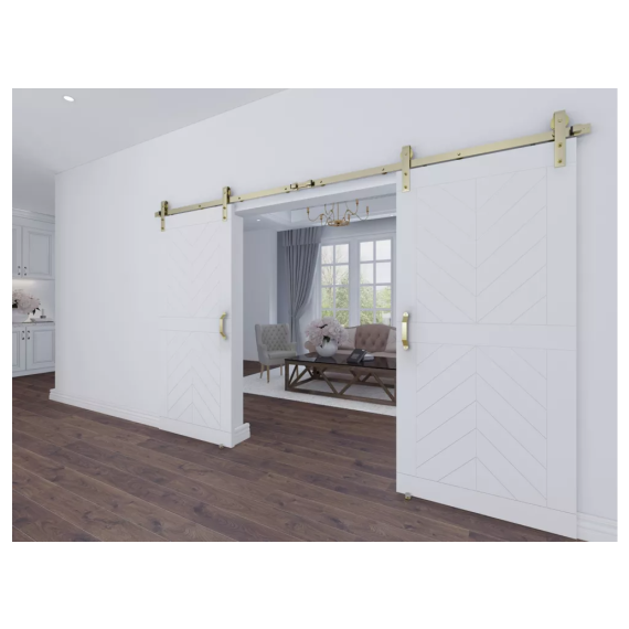 Interior barn door setup with white wood doors featuring gold toned hardware pulls in home improvement setting