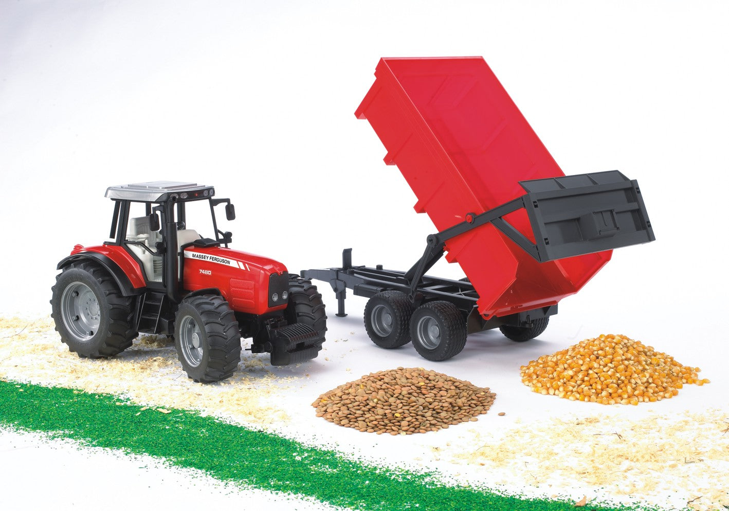 Red toy tractor with tipping trailer dumping grain piles in Vehicles & Remote Controlled Toys and Bruder Toys collections