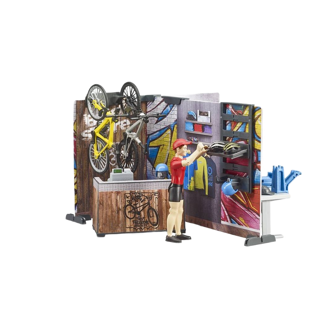 Miniature bike shop playset with figure, tools, yellow bike, and accessories in Toys & Games and Bruder Toys collections