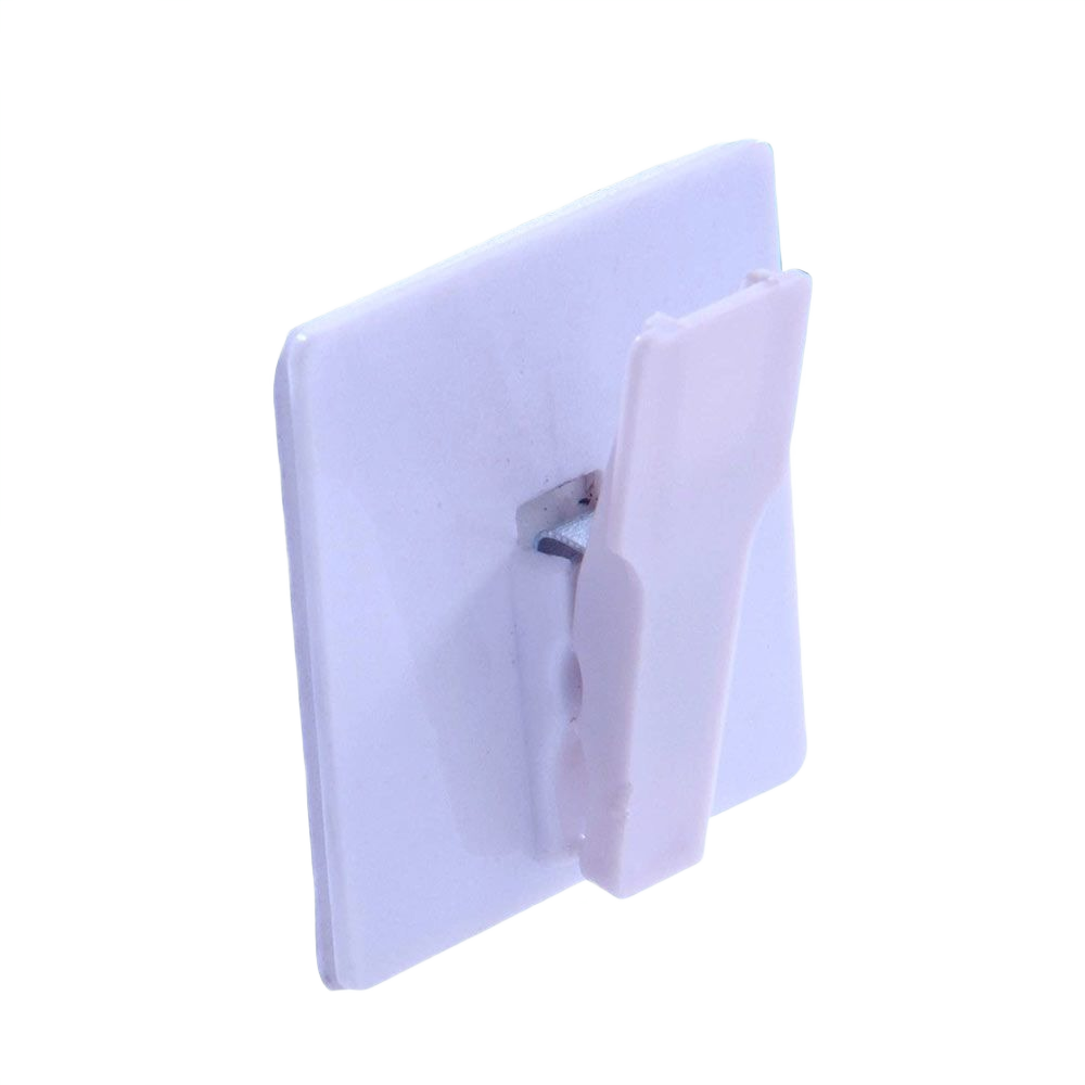 White plastic spring clip hook with adhesive backing for mounting signs and paper in storage and hardware collections