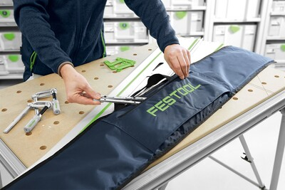 Blue storage bag with green Festool logo, designed for organizing and transporting woodworking and power tool accessories