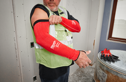 Pair of bright red protective sleeves with black trim designed for cut resistance during home improvement tasks