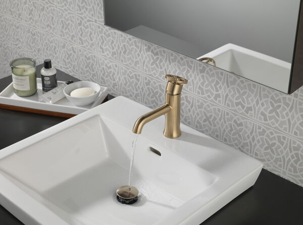 Champagne bronze single-handle bathroom faucet with industrial wheel handle in contemporary sink setup for home improvement