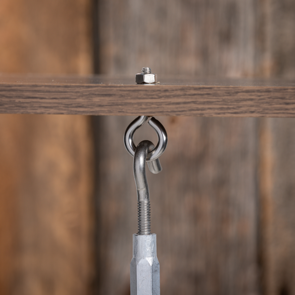 Stainless steel eye bolt with hex nut securely fastened to wood, part of hardware and fasteners collections