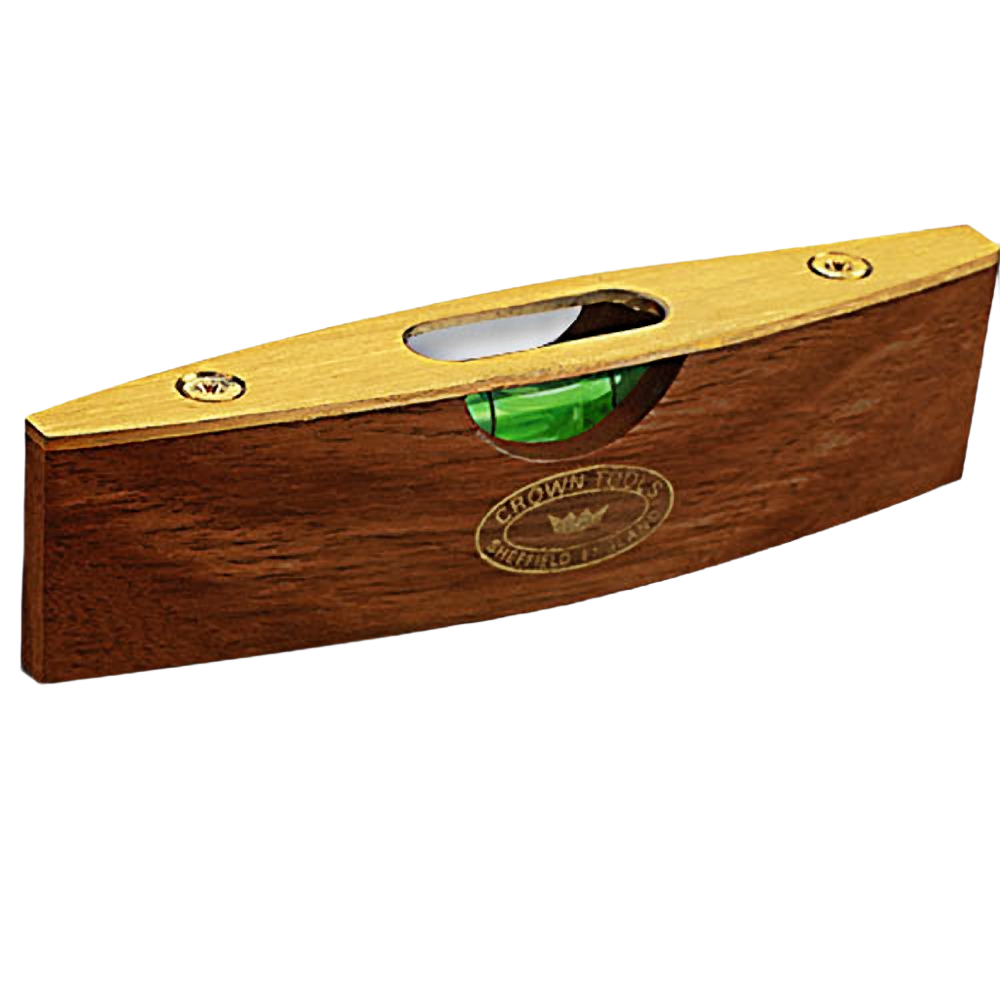Compact wooden spirit level with brass top plate and green vial, designed for precise home improvement and woodworking tasks