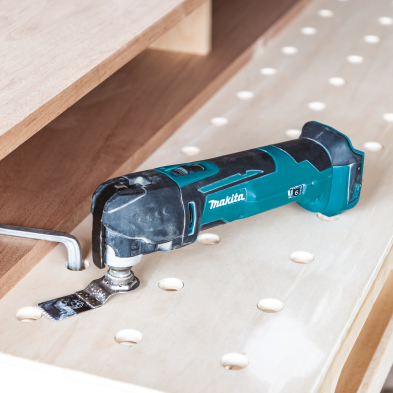 Cordless oscillating multi-tool with ergonomic grip and blue-black design for versatile home improvement tasks