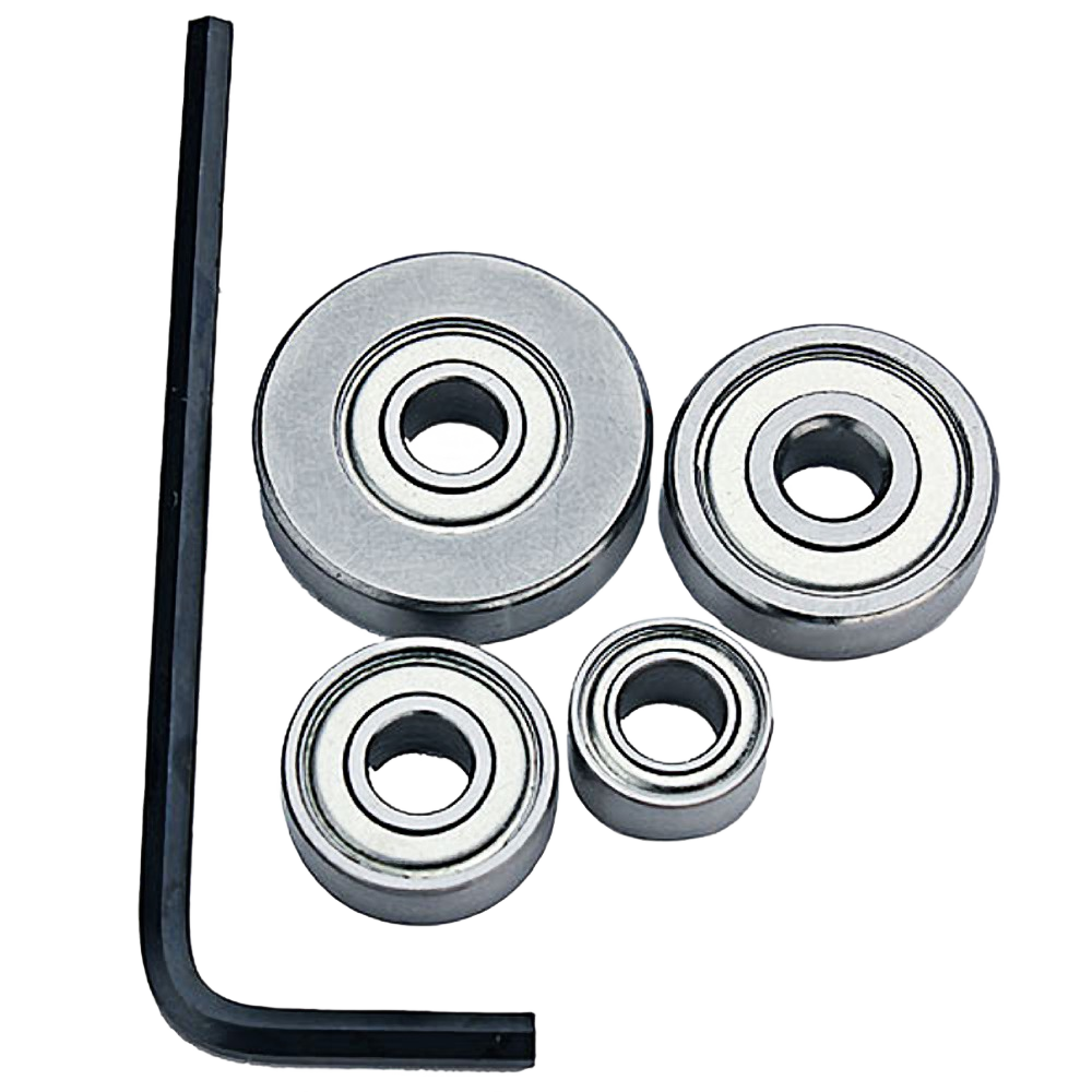 Set of four metal router bit bearings and a black hex key tool for use in tool accessories and power tool maintenance