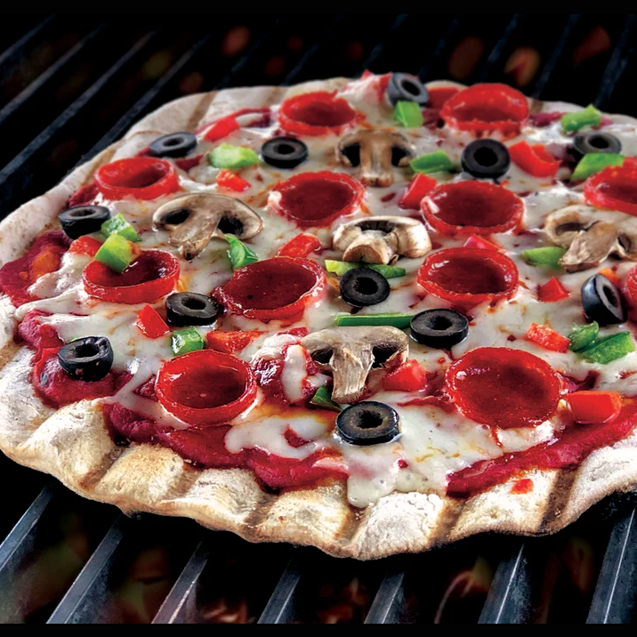 Grilled pizza topped with pepperoni, mushrooms, black olives, green peppers, and melted cheese on a crispy crust