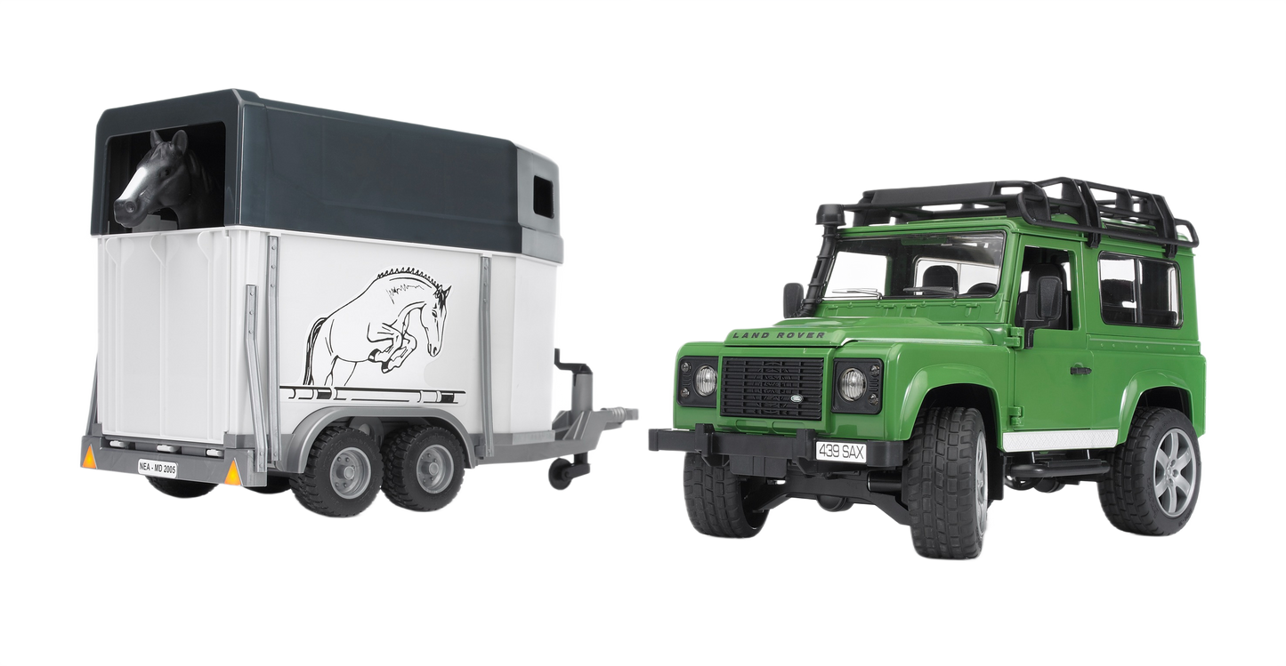Green Land Rover toy pulling a white horse trailer with a black horse figure inside and detailed exterior design