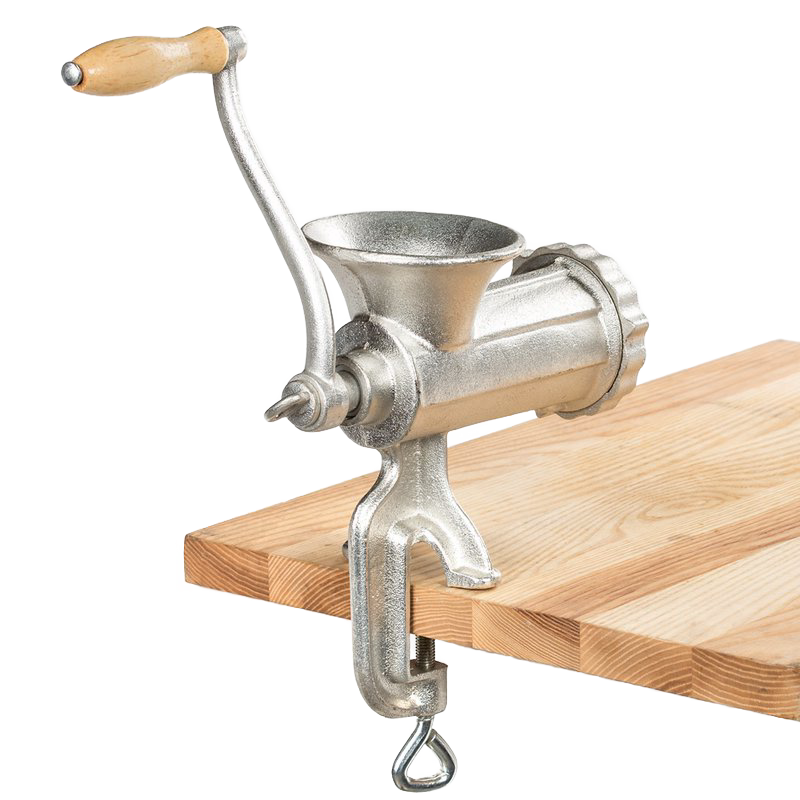 Manual heavy-duty meat grinder with wooden handle and tinned coating clamped to wooden table in kitchenware collection