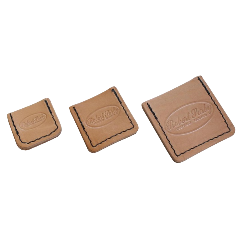 Set of three tan leather edge guards with black stitching and embossed branding for tool protection in home improvement tasks