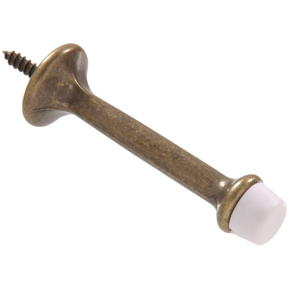 3-inch rigid door stop with antique brass finish and white rubber tip for door and wall protection in hardware collections