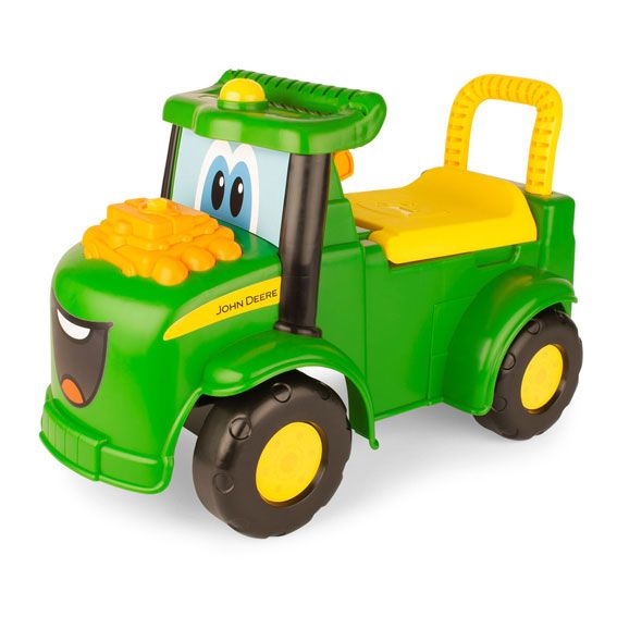 Green and yellow John Deere ride-on tractor toy with smiling face and interactive engine for toddlers under $100