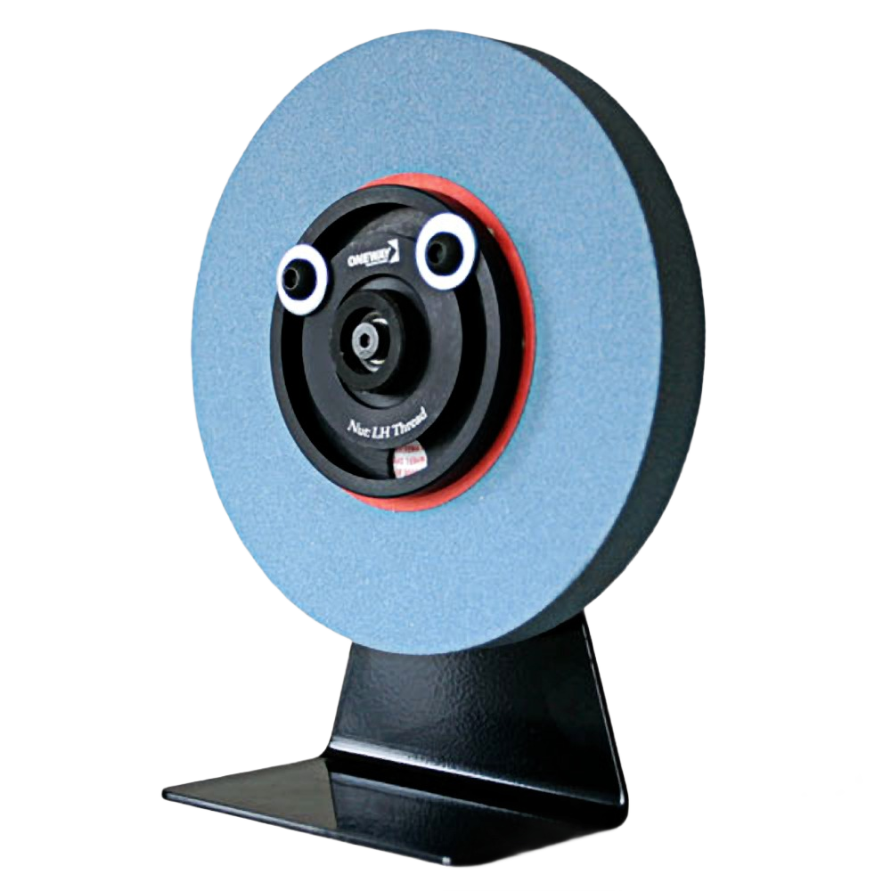 Blue abrasive balancing wheel mounted on black metal stand for precise grinding wheel adjustment in tool use