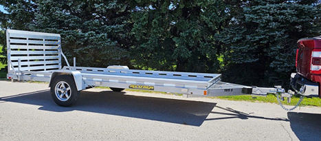 Lightweight aluminum utility trailer with single axle and ramp designed for hauling tools and home improvement materials