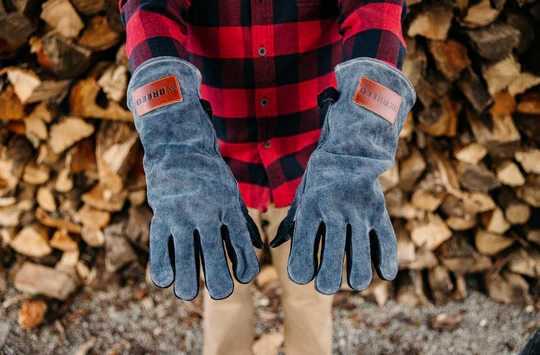Pair of gray leather fire gloves with branded leather patches for outdoor living and fire pits protection under $100 collection