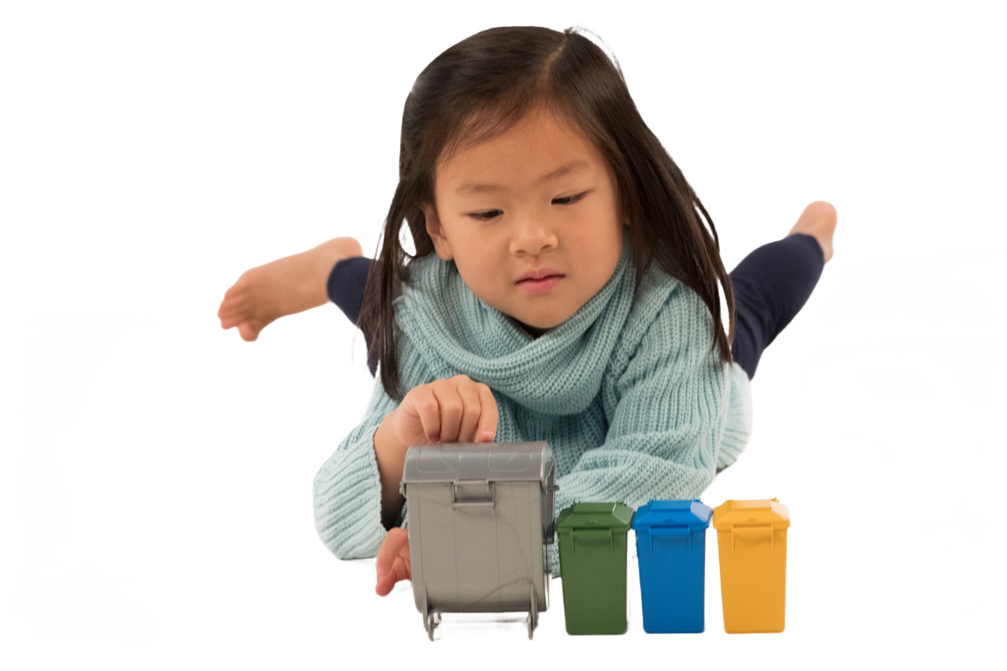 Young child playing with a set of four miniature Bruder Toys garbage cans for home improvement play