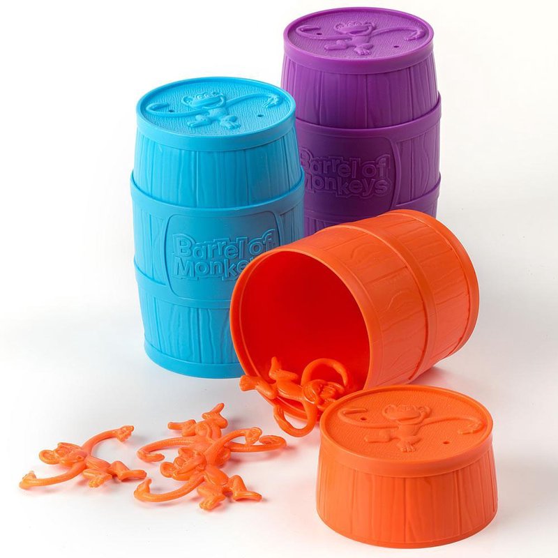 Colorful plastic barrels with bright orange monkeys for engaging tabletop game entertainment and fun play sessions