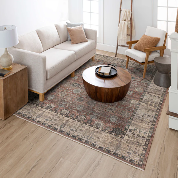 Muted red and beige abstract patterned area rug in living room setting for Rugs and Home Decor collections
